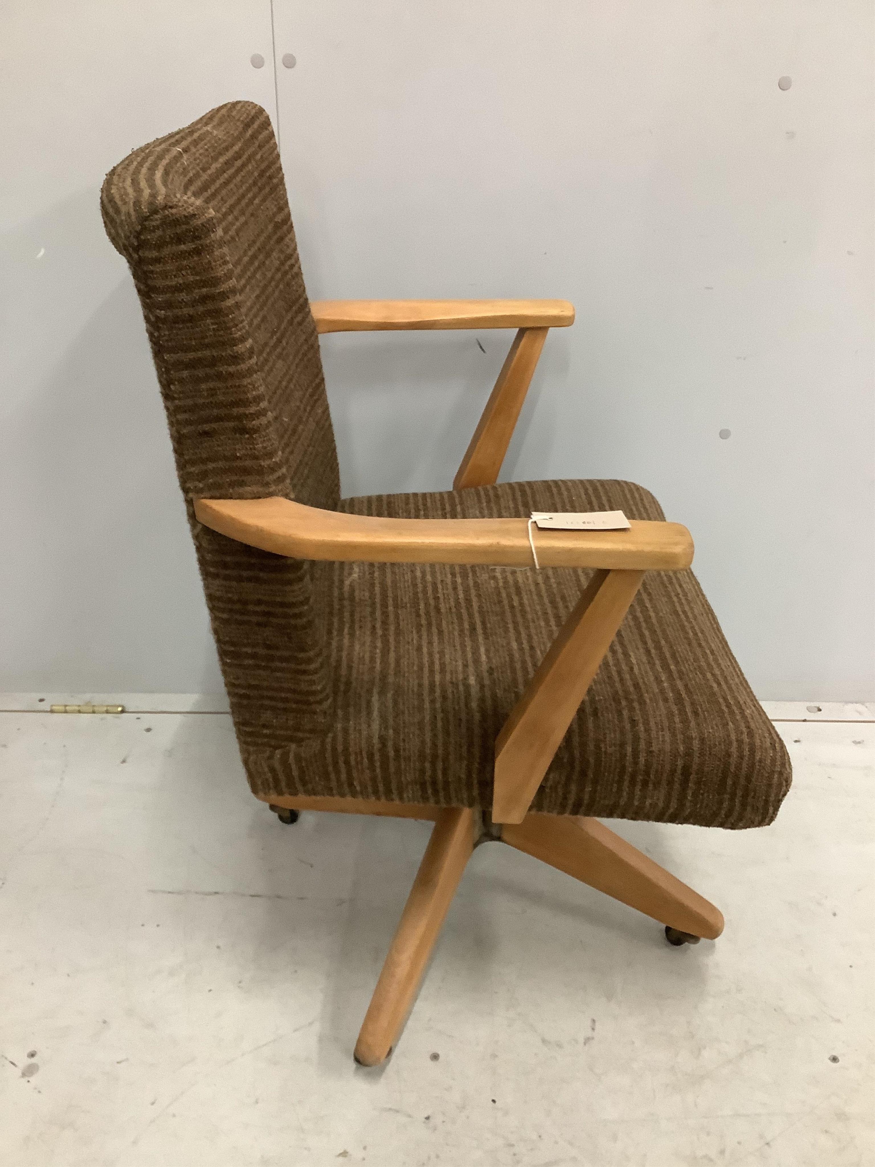 A mid century swivel office chair, width 59cm, depth 45cm, height 88cm. Condition - fair